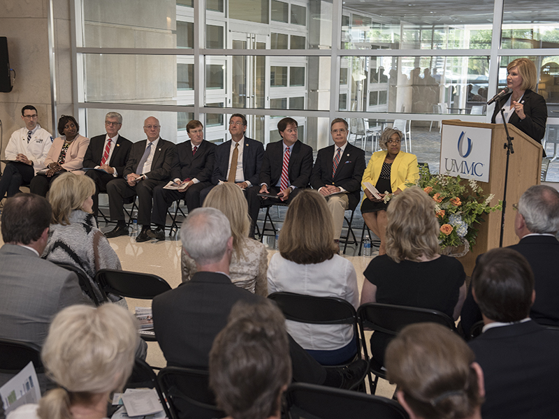 Dr. LouAnn Woodward, UMMC vice chancellor for health affairs and dean of the School of Medicine, addresses dignitaries attending dedication ceremonies for the new School of Medicine.